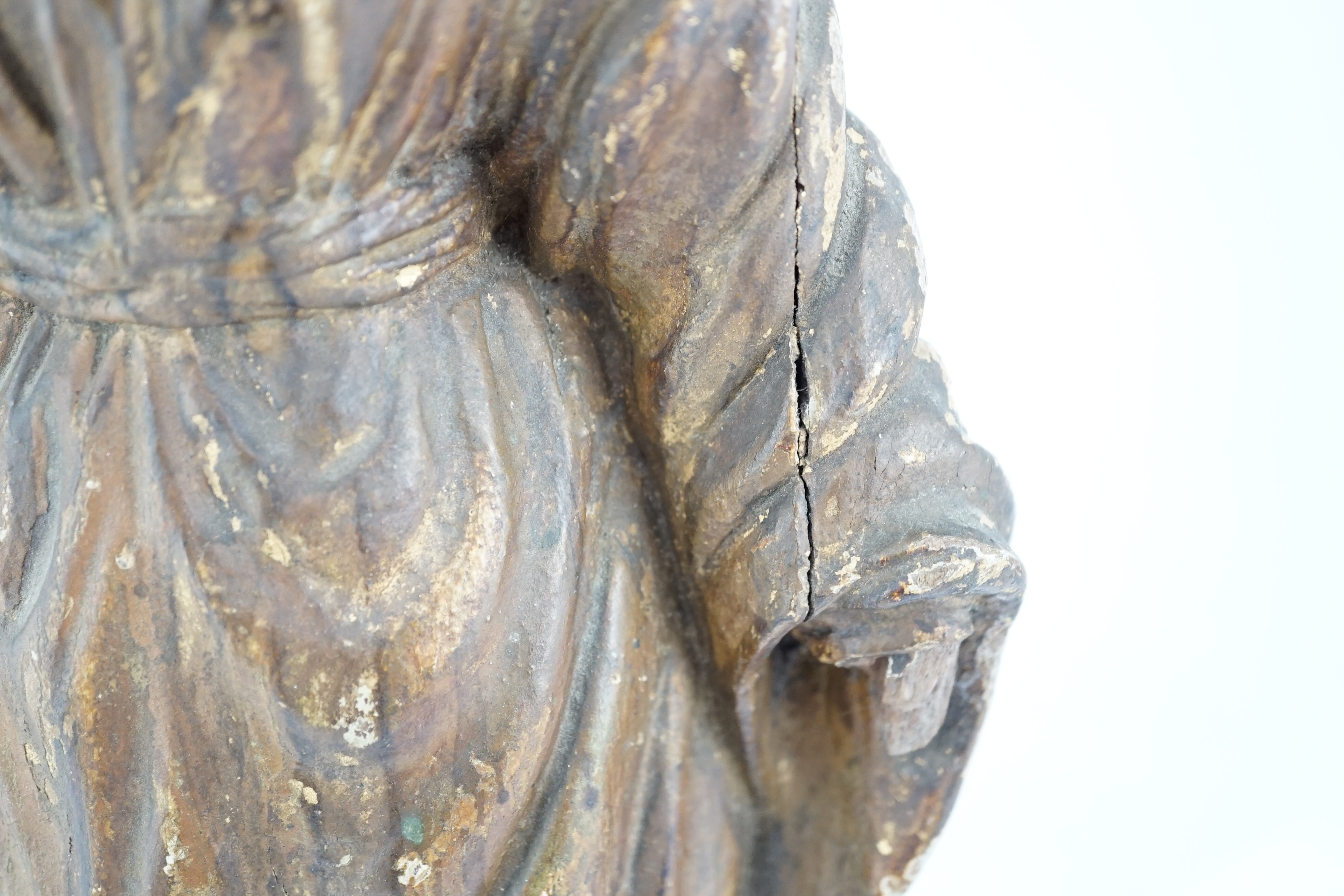 An 18th century Continental carved wood figure of a female saint